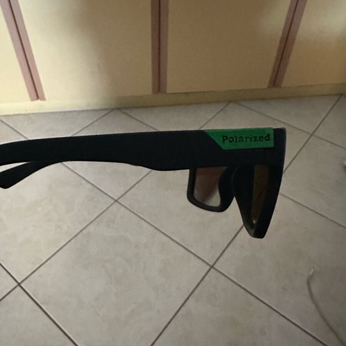 Polarized sunglasses new with green lens and black frame