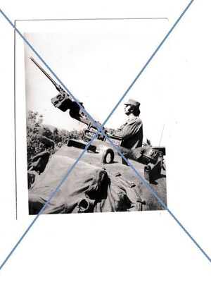 Black and white photo of army technical corps with machine gun and tank