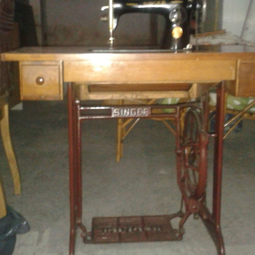 Singer sewing machine used with cabinet