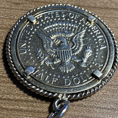 Collectible pendant large 1968 half dollar coin with silver wreath, like new