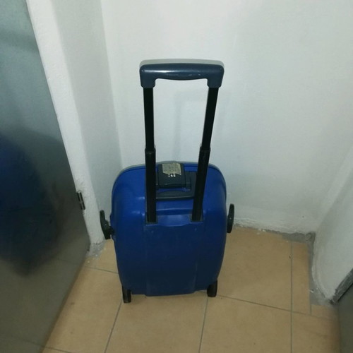 Hard plastic suitcase with lock and wheels