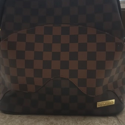 Sprayground backpack like new, brown and black