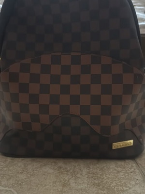 Sprayground backpack like new, brown and black
