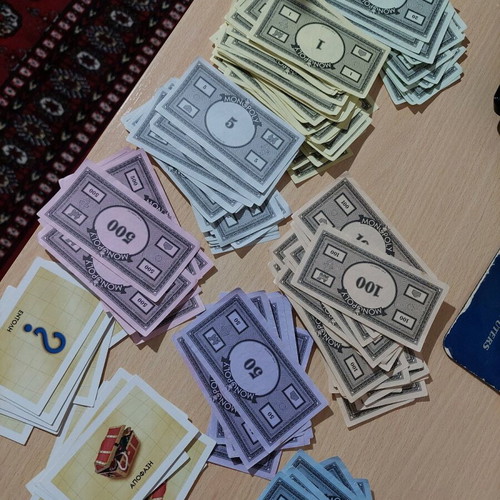 Monopoly money and decision cards in good condition