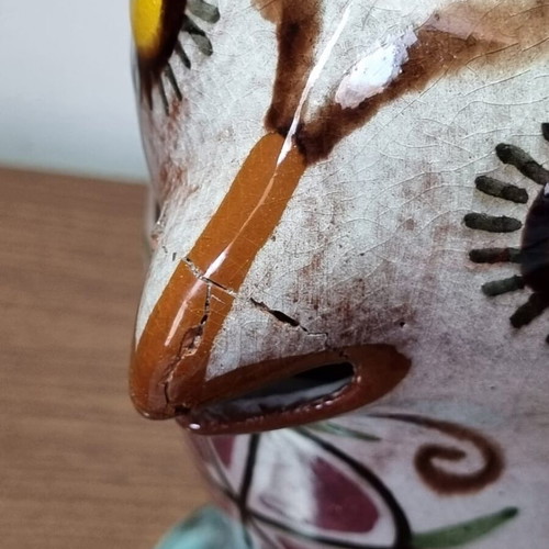Ceramic owl pitcher used, broken and glued on the beak