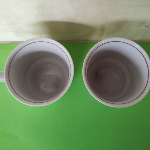 Kahla porcelain cups with roses and gold rim used, set of 2