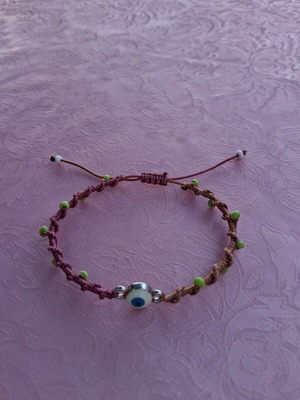 Macrame bracelet like new, two-tone with decorative beads and evil eye