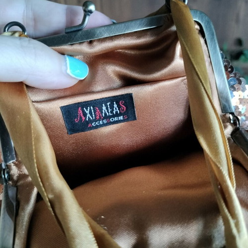 Pouch like new, gold copper with ribbon and sequins