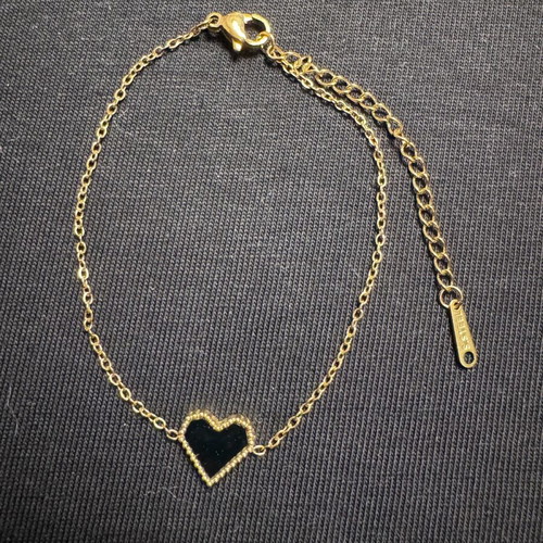 Women's bracelet new in gold tone with black heart