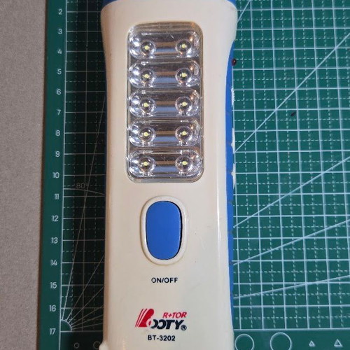Rechargeable flashlight BT-3202 like new with FM radio and 15 LED