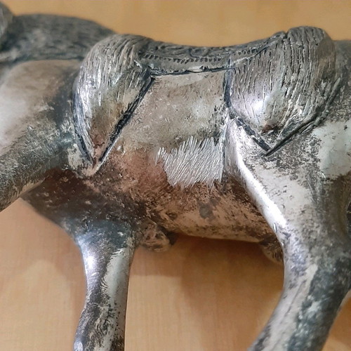 Vintage metal horse used with carved details