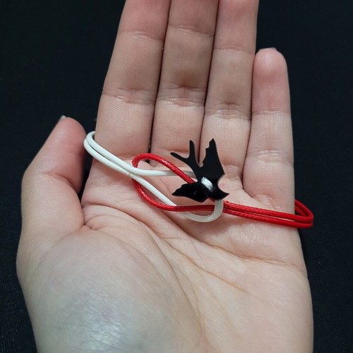 Martis swallow bracelet like new, handmade, white and red cord