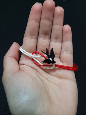 Martis swallow bracelet like new, handmade, white and red cord