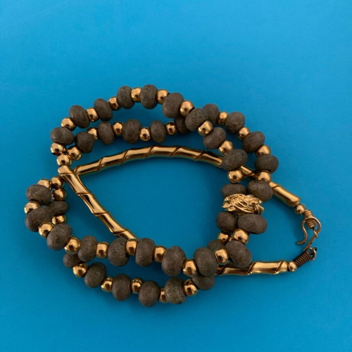 Necklace with khaki stone and gold used