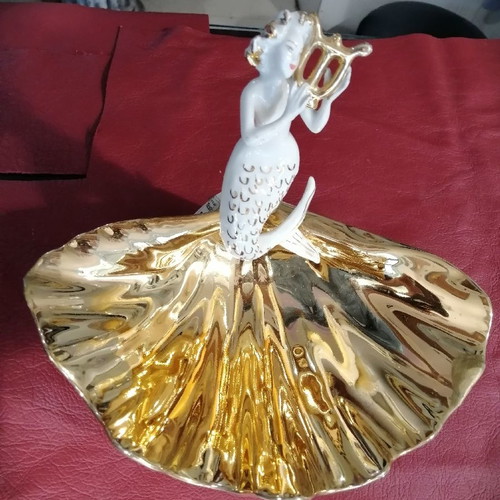 Mermaid and clam used, gold and porcelain decoration