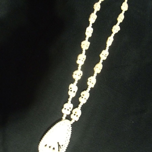 Old jewelry necklace used with white ornaments