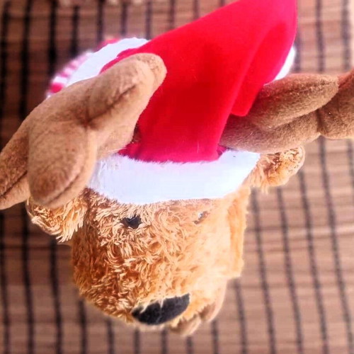 Plush reindeer that plays music with batteries