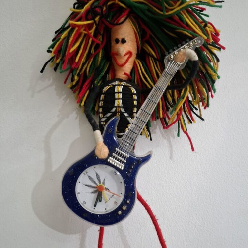 Vintage Table Clock Rastaman Figurine with Guitar like new