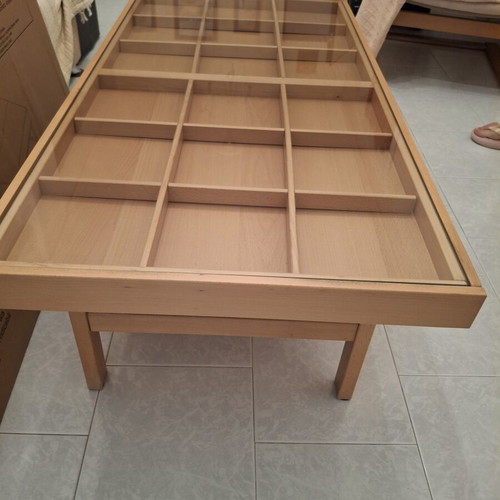 Wooden coffee table with display frame and lower shelf