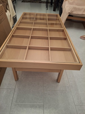 Wooden coffee table with display frame and lower shelf