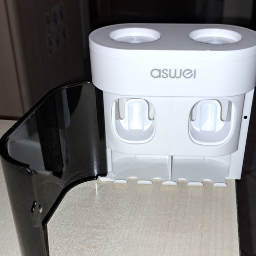 Toothbrush holder with 4 slots and 2 toothpaste dispensers new