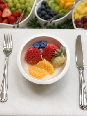 Handmade scented fruit candle in reusable porcelain powder container