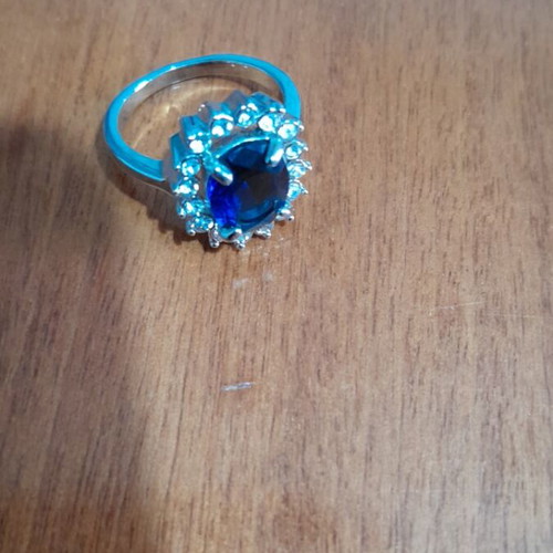 Ring with blue stone like new, silver color