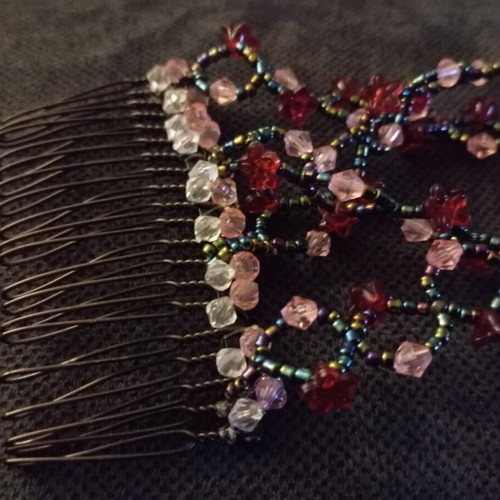 Hair comb like new with red, pink, black and transparent beads