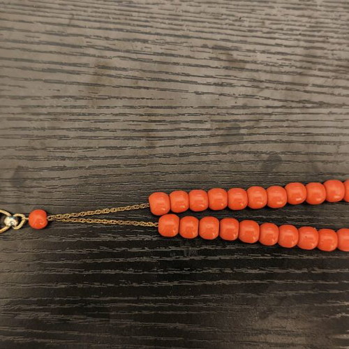 Worry beads used with orange beads and metal chain