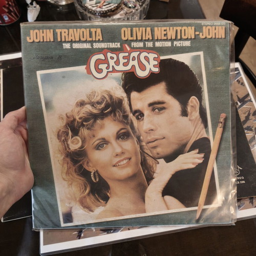 Grease vinyl records used, John Travolta and Olivia Newton-John
