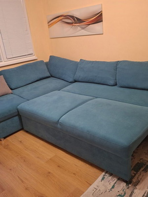 Tuscan large corner sofa used, turquoise color with storage and sleeping area