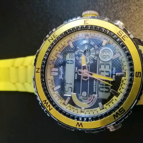Watch with yellow strap missing one button, works