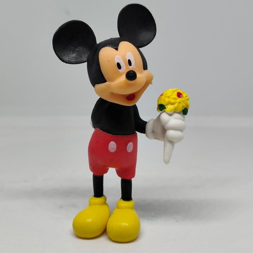 Collectible Mickey Mouse figure like new with bouquet
