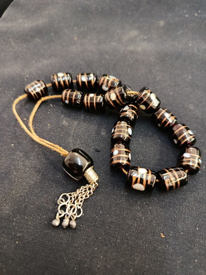 Worry beads made of mineral stone and copper specks, used