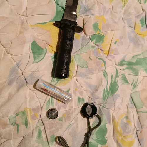 Survival knife used with needles, threads and compass