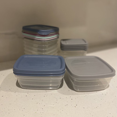 Set of small plastic food storage containers