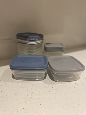 Set of small plastic food storage containers