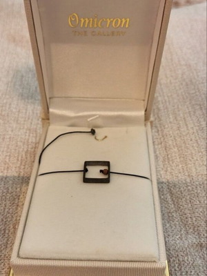 Minimalist bracelet like new with black cord and geometric square