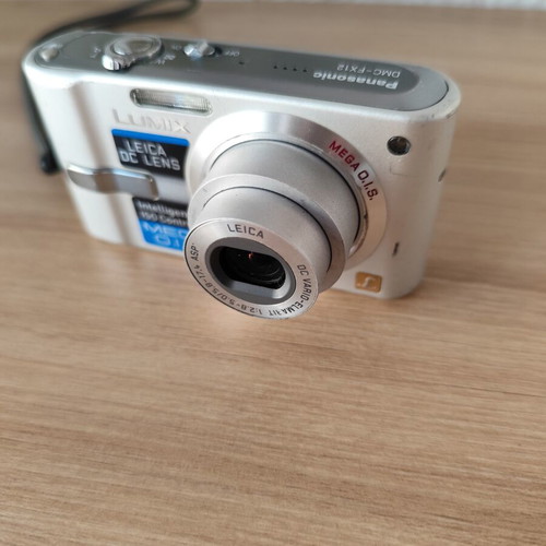 Panasonic Lumix DMC-FX12 digital camera used with accessories
