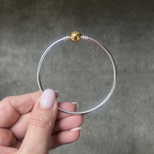 Pandora bracelet with gold clasp like new, size 20-21