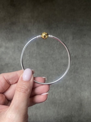 Pandora bracelet with gold clasp like new, size 20-21
