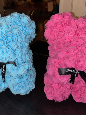Bear with artificial flowers like new
