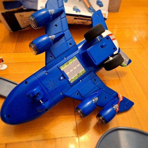 Airplane toy used with lights and sounds, transforms into station