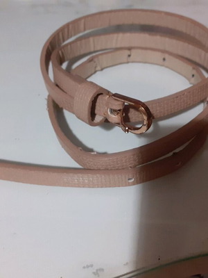 Beige belt thin like new with embossed leatherette and gold buckle