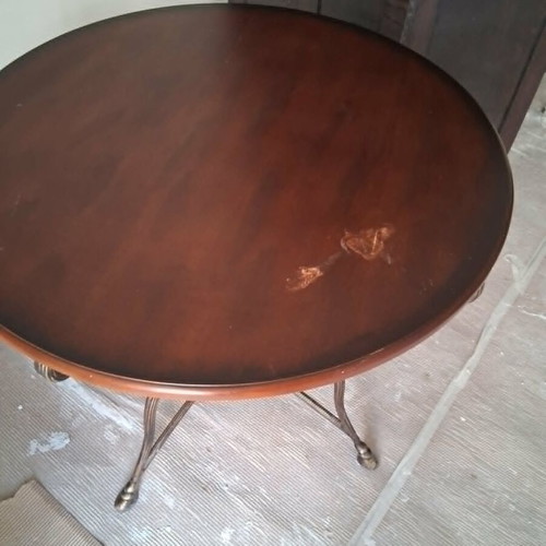 Rotunda table like new with heavy brass base and wooden top