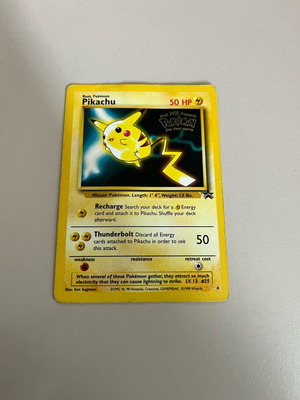 Pikachu 4 PR Normal card used with some signs of wear