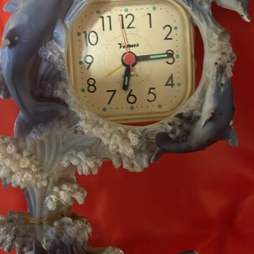 Clock used with dolphins around