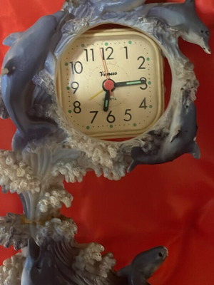 Clock used with dolphins around