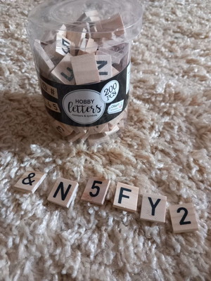 Wooden squares used with letters and symbols for crafts