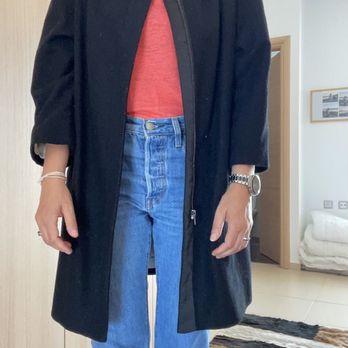 Black coat used with wool by Carling
